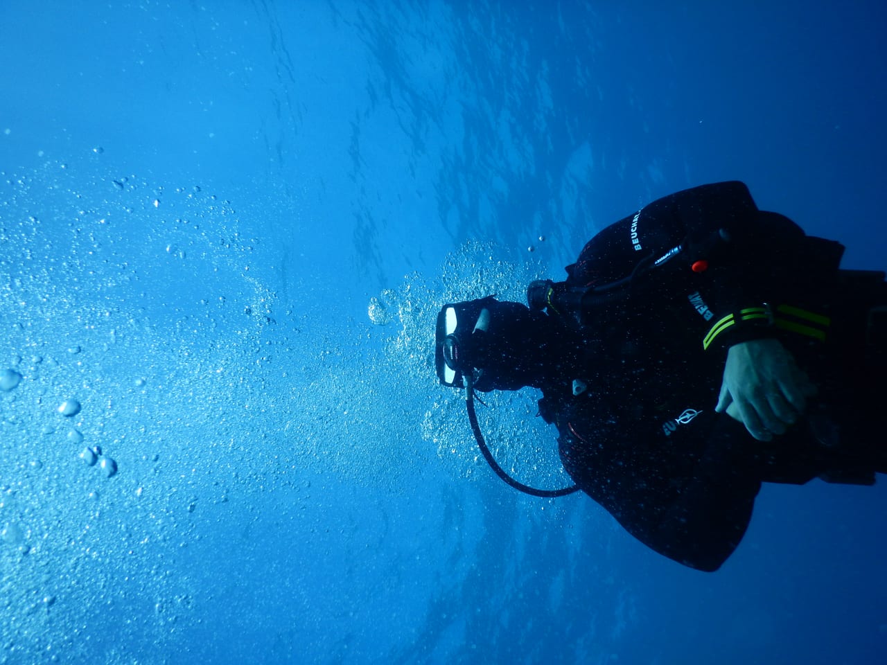 A first-time diver in shallow water with an instructor